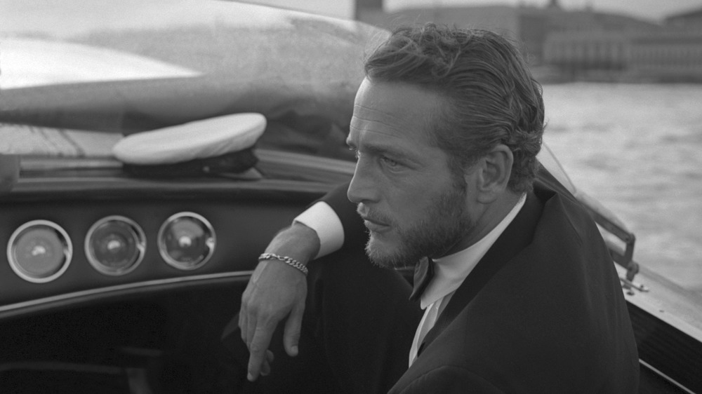 Paul Newman sitting on boat