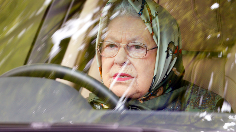 Queen driving range rover