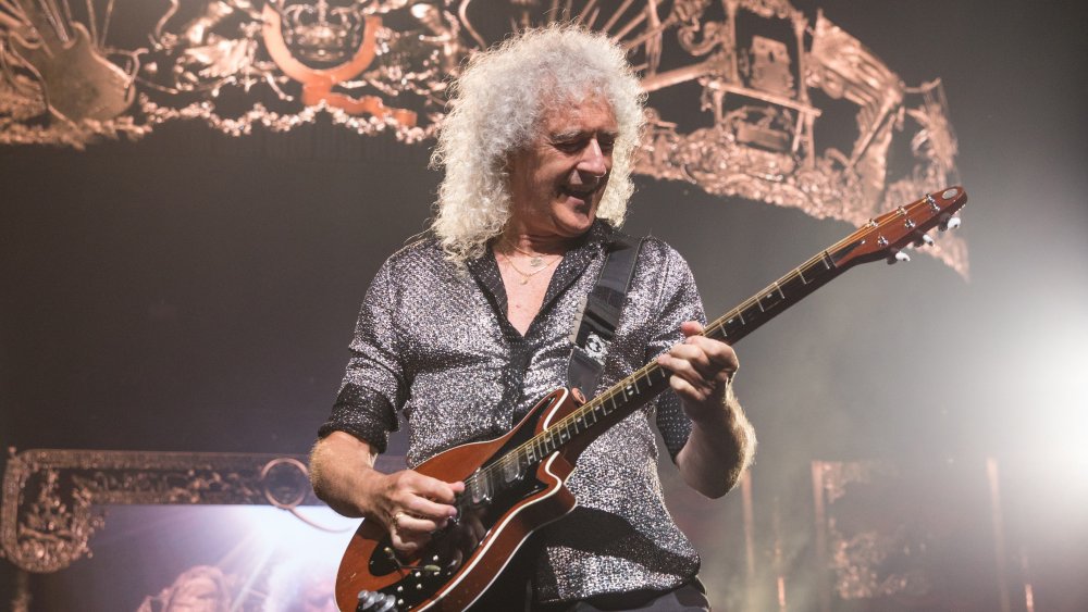 Brian May onstage in 2019