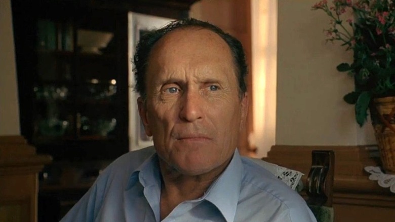Sonny Dewey sat staring blue shirt