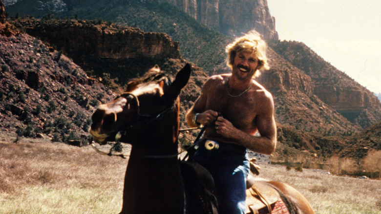 Robert Redford riding a horse