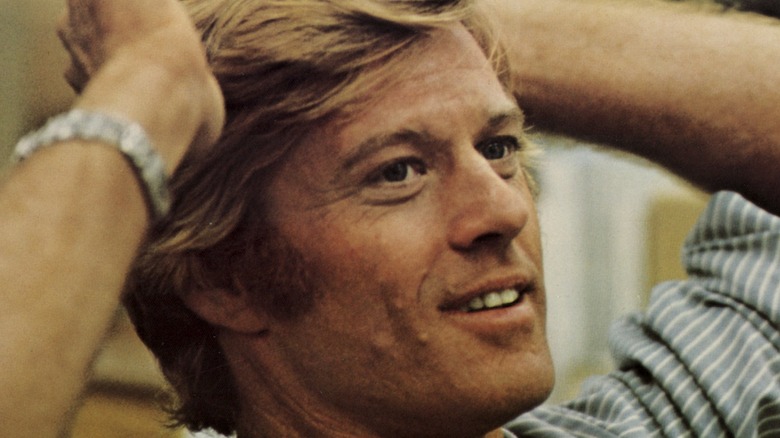 Robert Redford with hands on head
