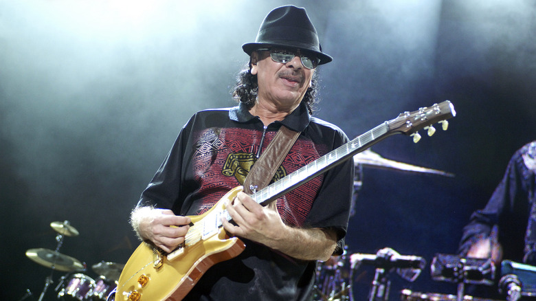 Carlos Santans performing on stage