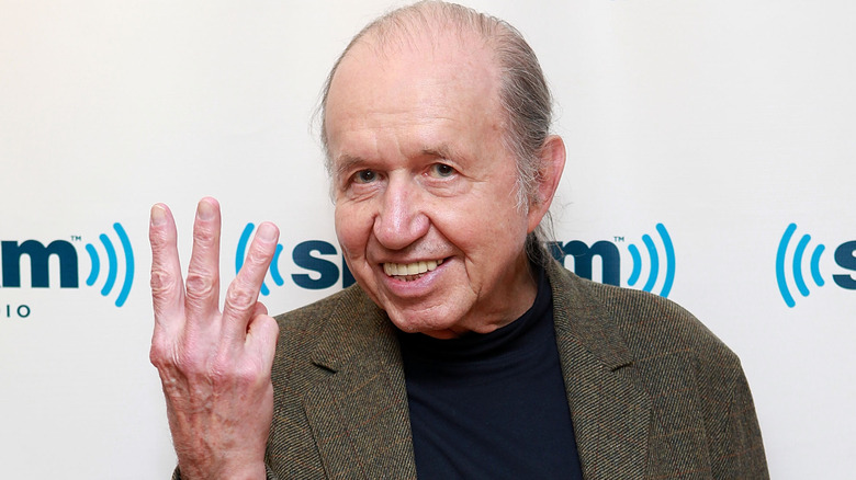Bob Dorough holding up three fingers