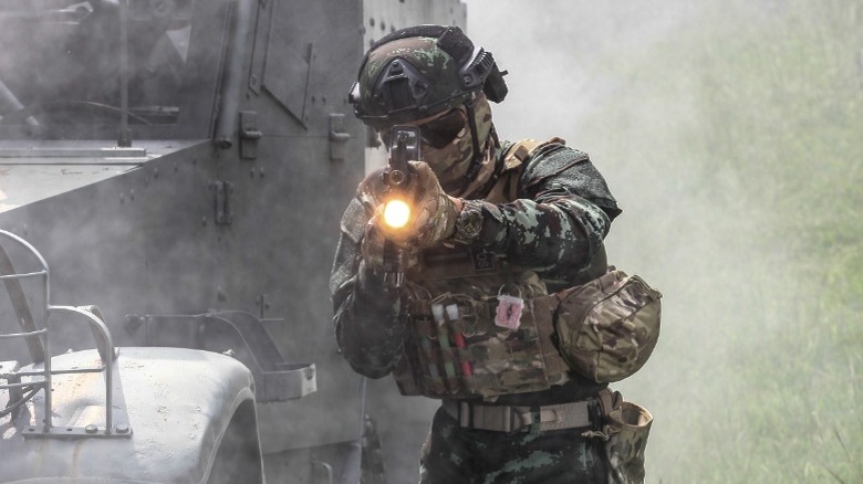 Navy SEAL firing weapon