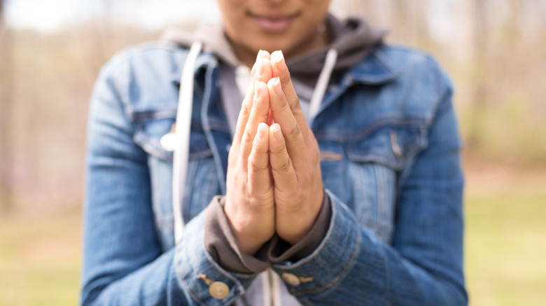 Hands together in prayer