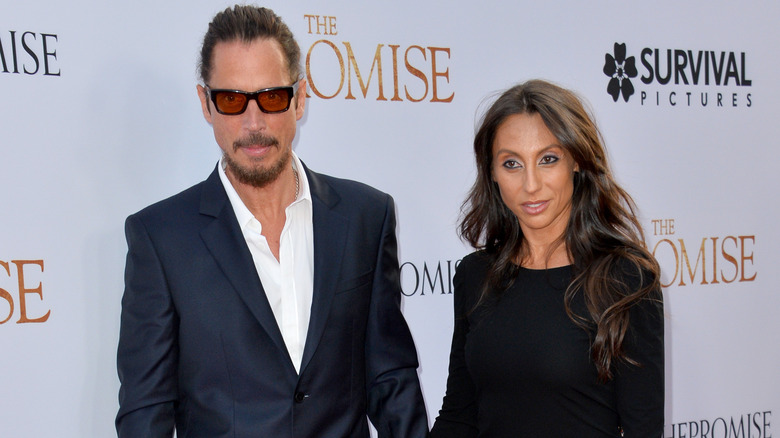 Chris and Vicky Cornell holding hands