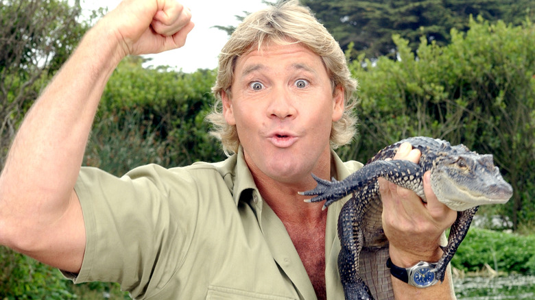 Steve Irwin holding baby crocodile
