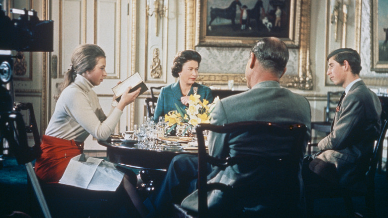 Elizabeth Philip Charles and Anne sitting around a table