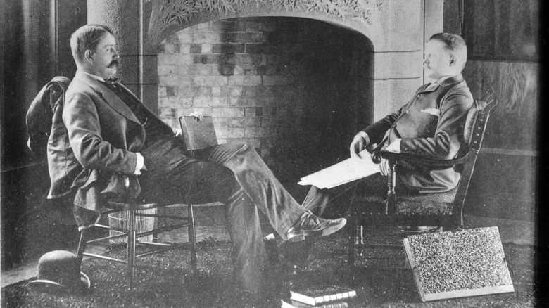 Daniel Burnham and John Root sitting