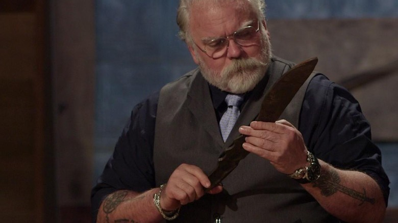 david baker looking at a knife on forged in fire