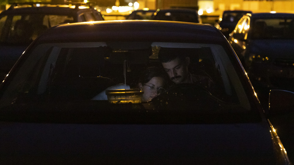 Couple cuddling in car