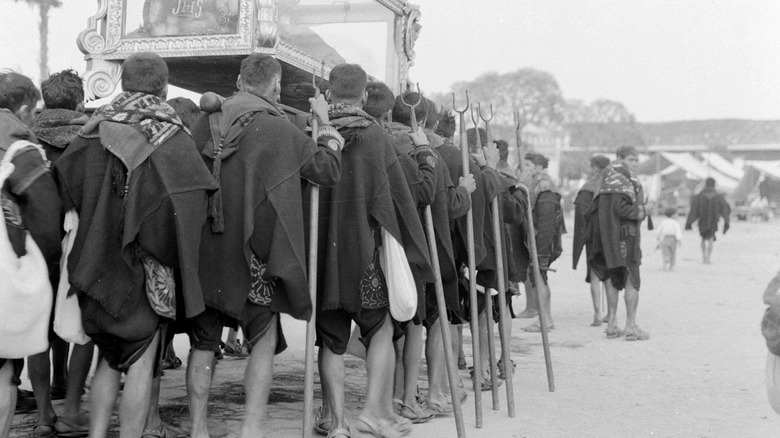 Guatemalans carry a coffin