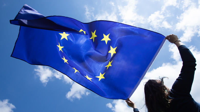 Woman holding flag of the European Union