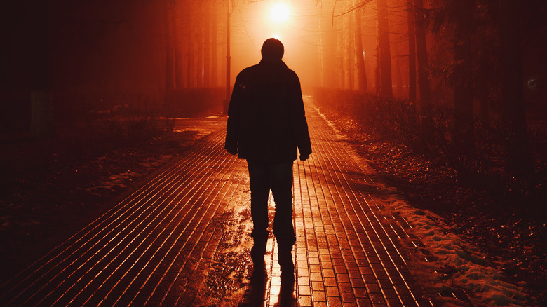 a person walking through fog