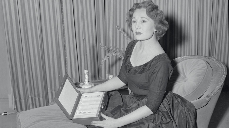 Magda Gabor holding box