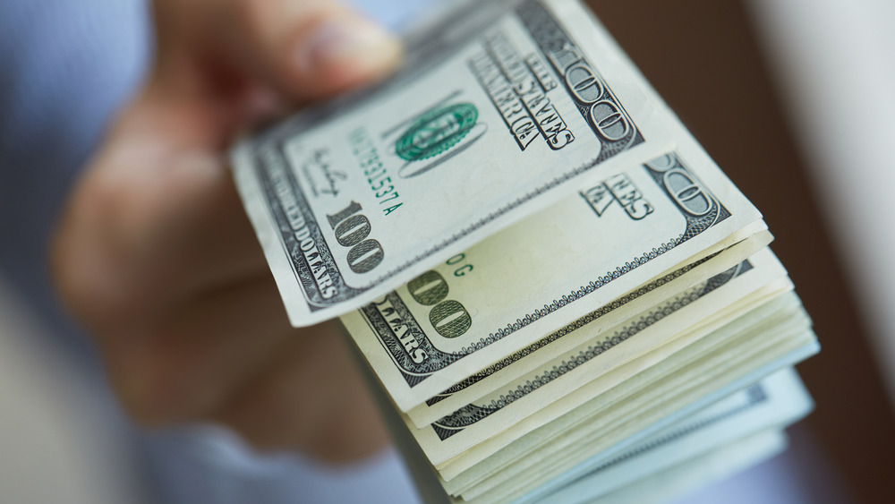 Hand holding cash