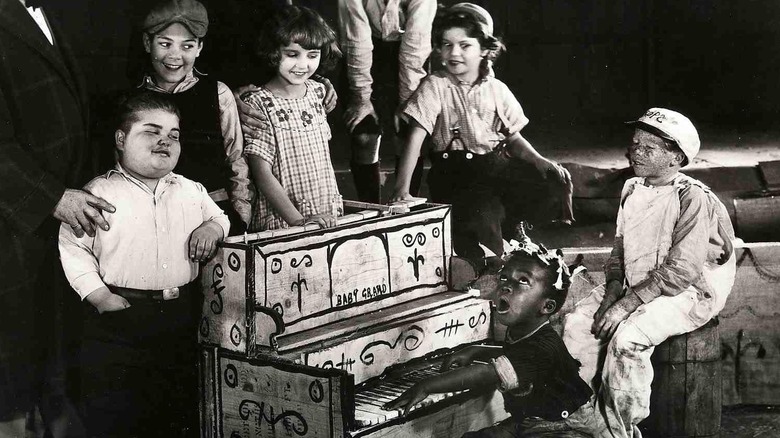 little rascals singing and playing a piano