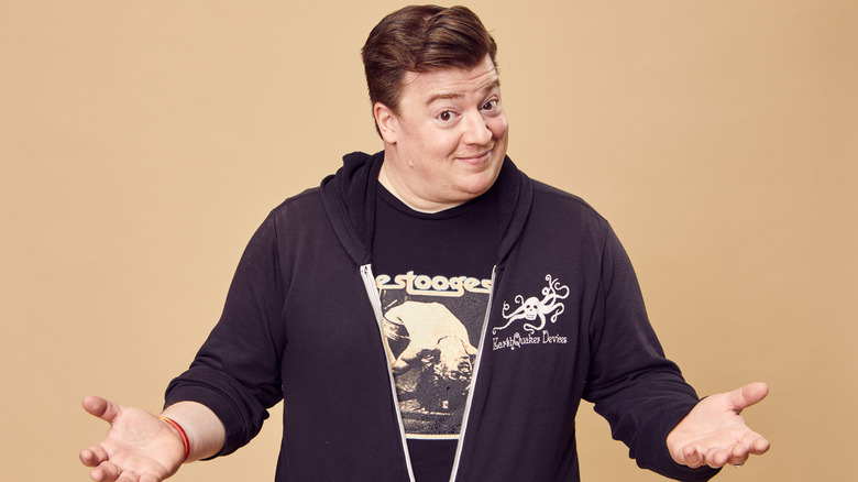 Danny Tamberelli gesturing for a posed photo in 2023
