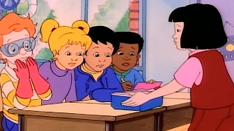 Wanda Li showing a container to her classmates in The Magic School Bus