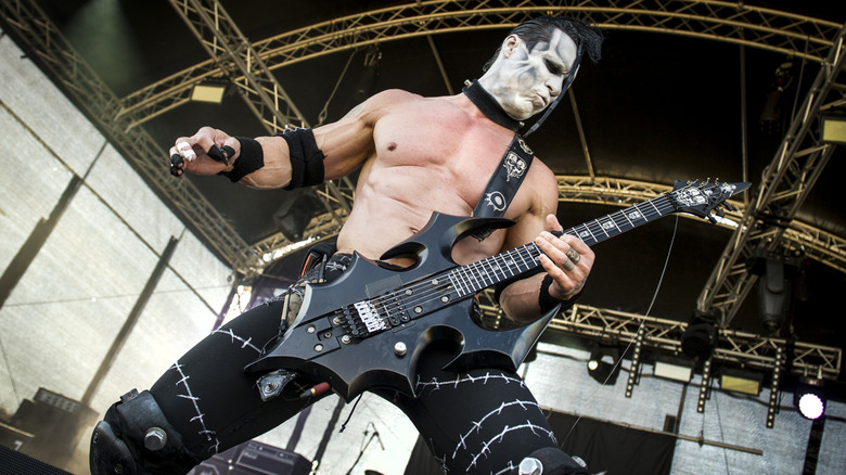 Doyle Wolfgang Von Frankenstein in facepaint playing guitar