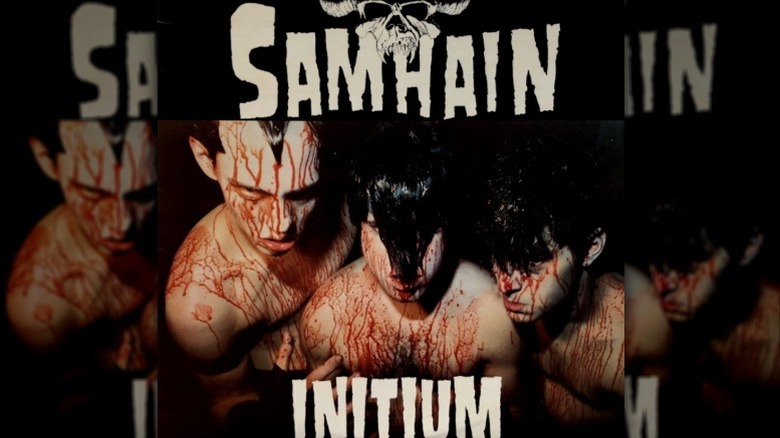 Cover art from Samhain's Initium with three men covered in blood