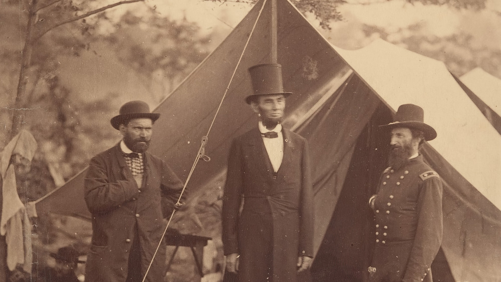 President Abraham Lincoln, Major General John A. McClernand (right), and E. J. Allen (Allan Pinkerton, left),