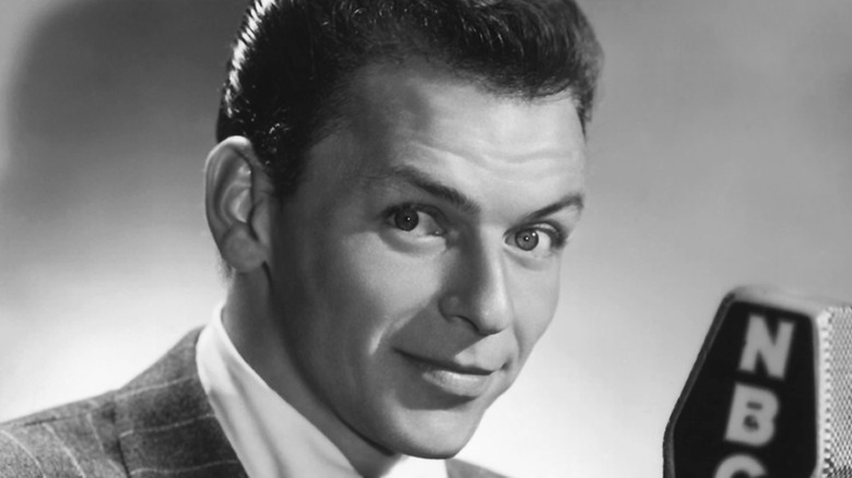 Frank Sinatra holding microphone