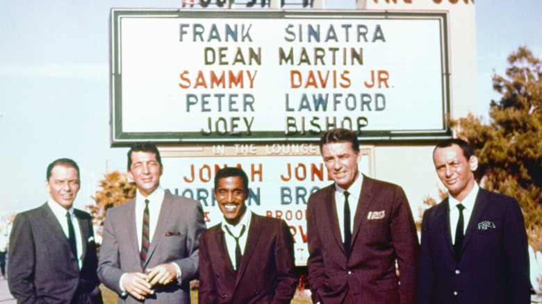 The Rat Pack posing in front of sign