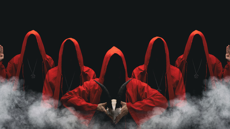 five people in red hoods