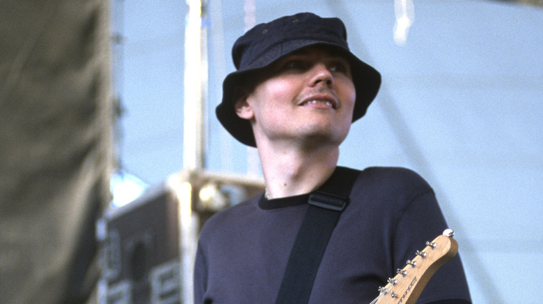 Billy Corgan playing guitar with New Order