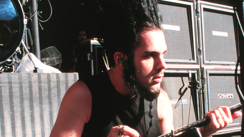Wayne Static playing guitar on stage