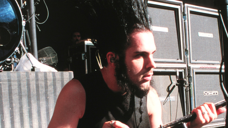 Wayne Static playing guitar on stage