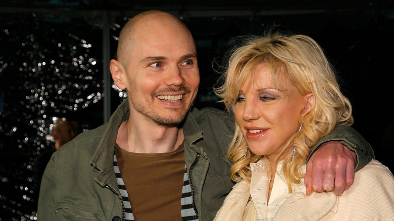 Billy Corgan with arm around Courtney Love