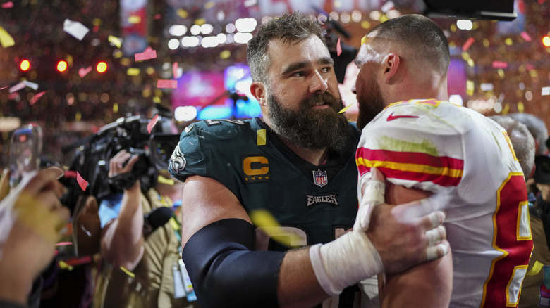 Travis and Jason Kelce on field hugging