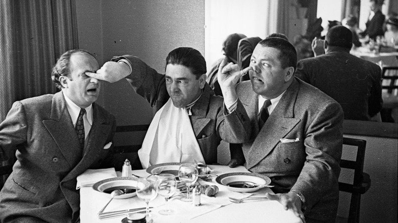 Larry, Moe, and Curly poke each other