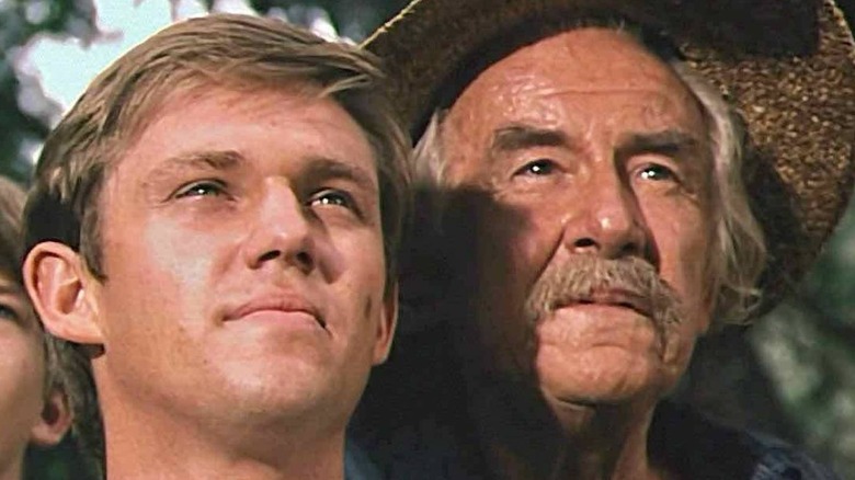 Richard Thomas and Will Geer staring out on The Waltons