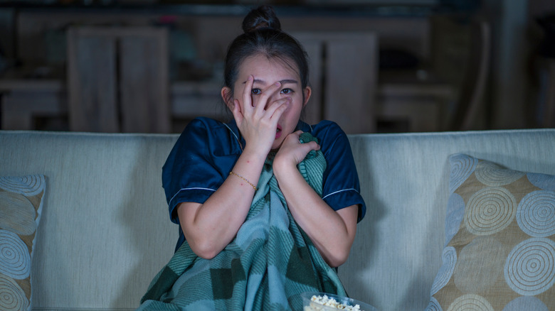 woman watching horror movie