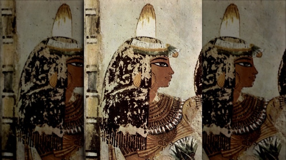 Ancient Egyptian woman in hieroglyph 