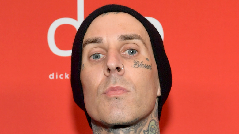 Travis Barker red background