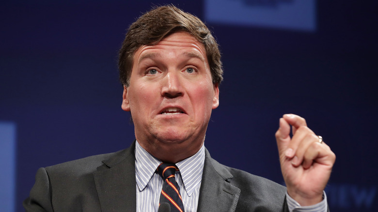 Carlson speaking hand up