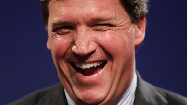 tucker carlson laughing