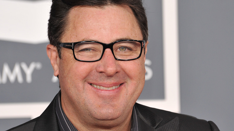 Vince Gill black glasses smiling