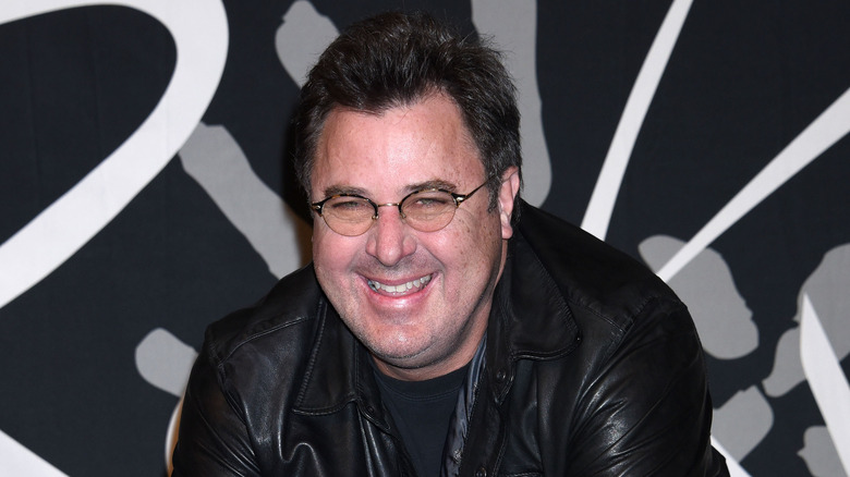 Vince Gill smiling leather jacket