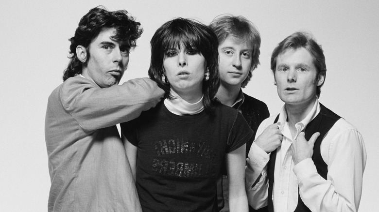 Pretenders together posing white background