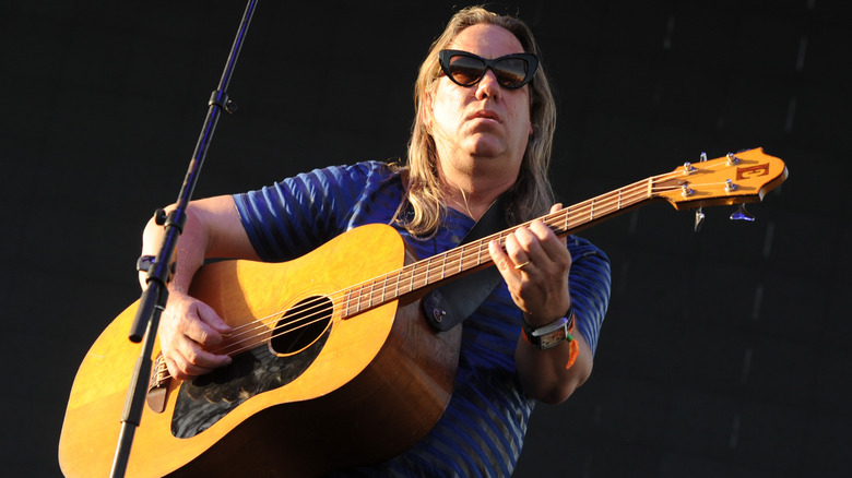 Brian Ritchie sunglasses playing acoustic bass