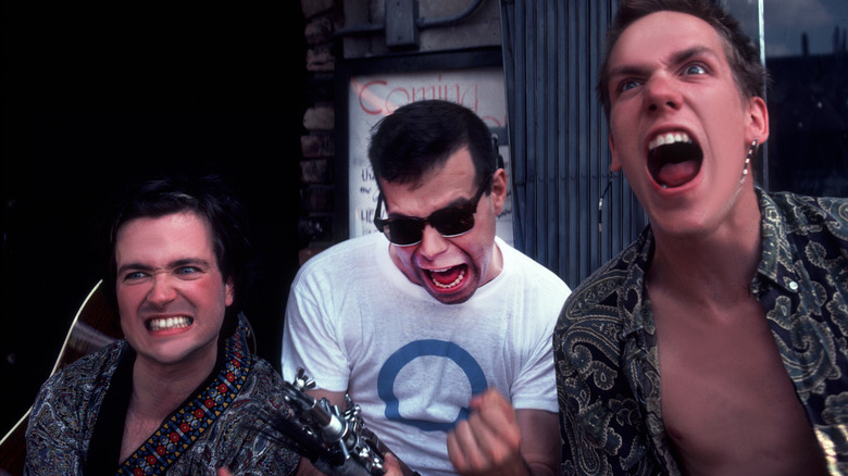 Violent Femmes outside together screaming