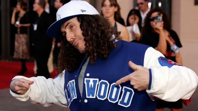 Weird Al Yankovic points to words on his letter jacket.