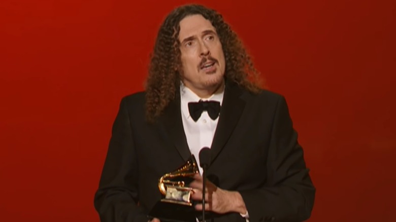 Weird Al Yankovic accepts Grammy Award in speech on stage.