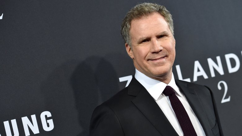 will ferrell smiling in black suit and tie